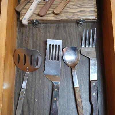 Drawer of wooden handled Kitchen utensils and Knives