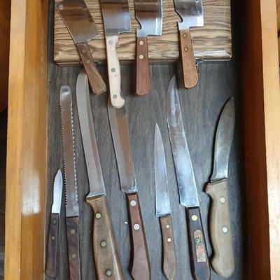 Drawer of wooden handled Kitchen utensils and Knives