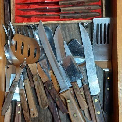 Drawer of wooden handled Kitchen utensils and Knives