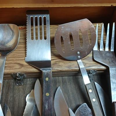 Drawer of wooden handled Kitchen utensils and Knives
