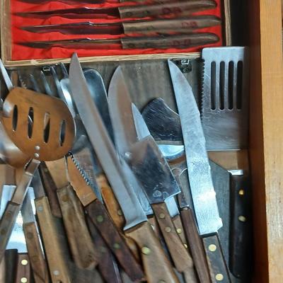 Drawer of wooden handled Kitchen utensils and Knives