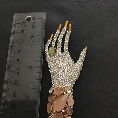 Really cool rhinestone hand brooch