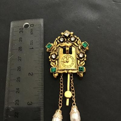 Cute gold tone clock brooch