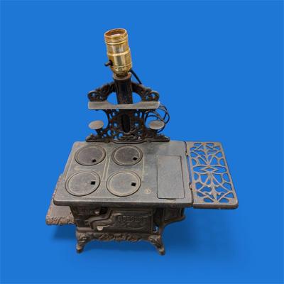 Sale Photo Thumbnail #59: Vintage Miniature Crescent Cast Iron Stove table Lamp.  tested Working