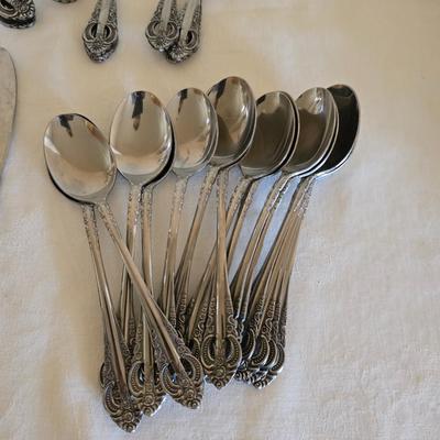 National stainless Japan flatware set - cream pitcher - candle sticks by Avon - and a beautiful metal covered butter dish