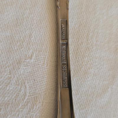 National stainless Japan flatware set - cream pitcher - candle sticks by Avon - and a beautiful metal covered butter dish