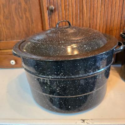 Two vintage speckled enamel stock pots with lids - small one has a strainer