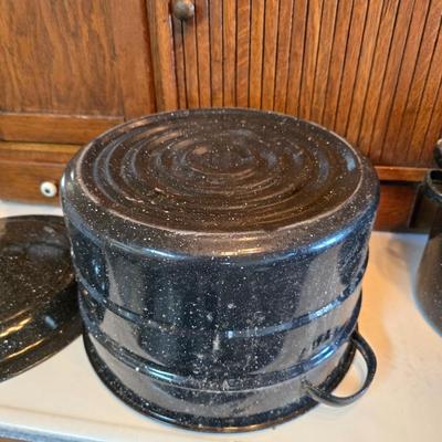 Two vintage speckled enamel stock pots with lids - small one has a strainer