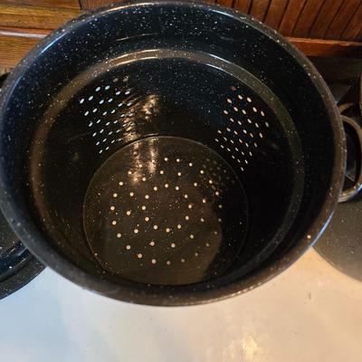 Two vintage speckled enamel stock pots with lids - small one has a strainer