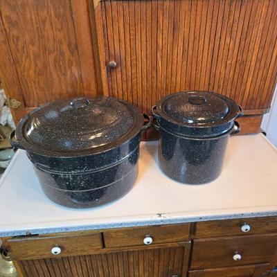 Two vintage speckled enamel stock pots with lids - small one has a strainer