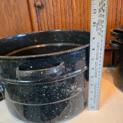 Two vintage speckled enamel stock pots with lids - small one has a strainer