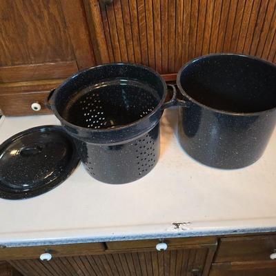 Two vintage speckled enamel stock pots with lids - small one has a strainer