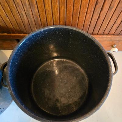 Two vintage speckled enamel stock pots with lids - small one has a strainer