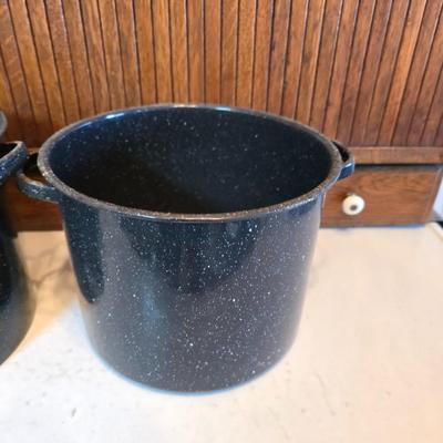 Two vintage speckled enamel stock pots with lids - small one has a strainer