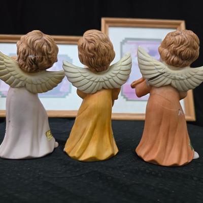 Angel figures with two framed Anne Geddes framed wall art pictures