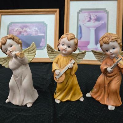 Angel figures with two framed Anne Geddes framed wall art pictures