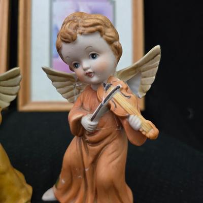 Angel figures with two framed Anne Geddes framed wall art pictures
