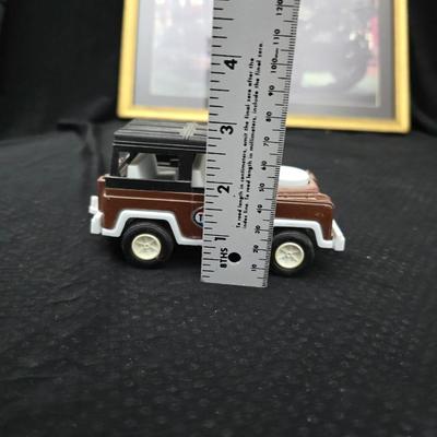 Vintage Tootsie Toy Land Rover diecast toy car. with framed picture of a 1920 Pierce-Arrow Series 51 Enclosed Limousine - Woodrow Wilson