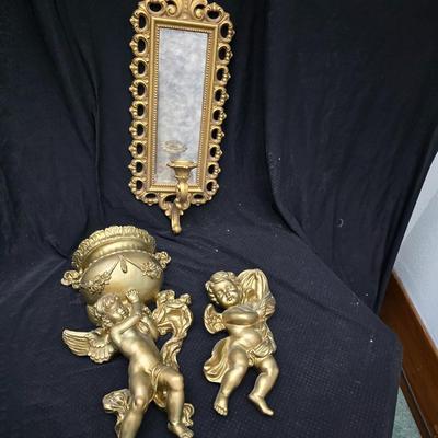 Homco Dart wall sconce with a smoked mirror and a gold-toned plastic frame. with angels - gold cherub or putto.wall art and vintage gold...