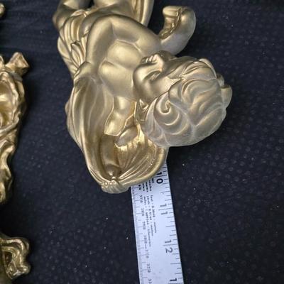 Homco Dart wall sconce with a smoked mirror and a gold-toned plastic frame. with angels - gold cherub or putto.wall art and vintage gold...