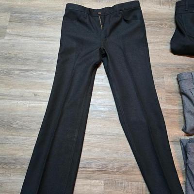 Seven pairs of Men's Wrangler brand slacks - see pictures for all sizes