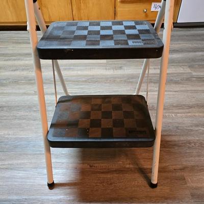 Stepstool with small tools and a box of assorted cords and a nice power supply usb box