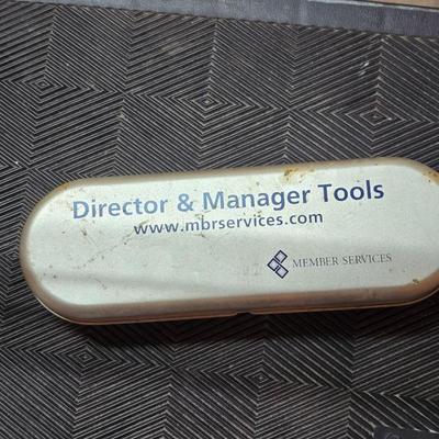 Stepstool with small tools and a box of assorted cords and a nice power supply usb box