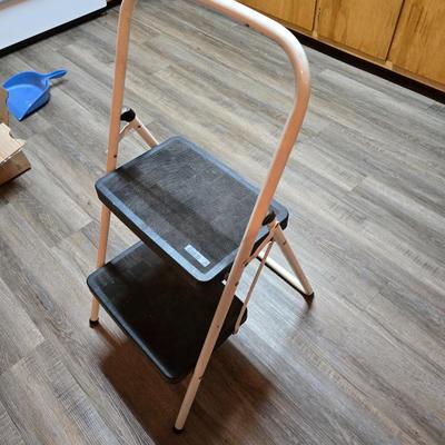 Stepstool with small tools and a box of assorted cords and a nice power supply usb box