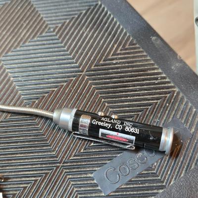 Stepstool with small tools and a box of assorted cords and a nice power supply usb box