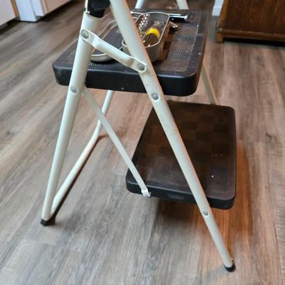 Stepstool with small tools and a box of assorted cords and a nice power supply usb box