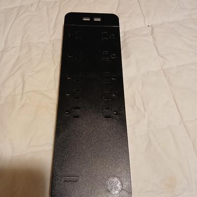 Stepstool with small tools and a box of assorted cords and a nice power supply usb box