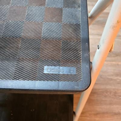 Stepstool with small tools and a box of assorted cords and a nice power supply usb box