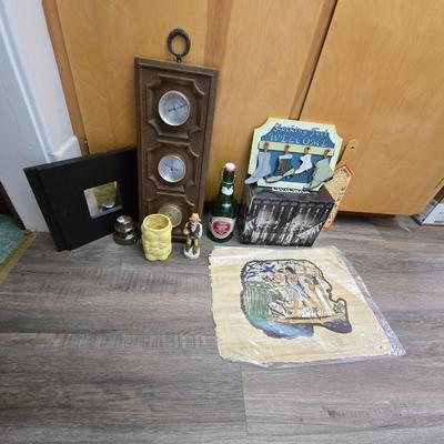 Barometer - Civil war VHS tapes - Two wall mirror accent pieces - and an assortment of other items that didn't get placed in lots.