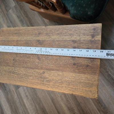 Wooden cane back glider with green cushions - a small table and an antique wooden stool