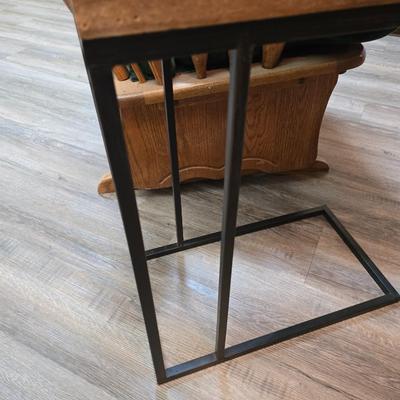 Wooden cane back glider with green cushions - a small table and an antique wooden stool