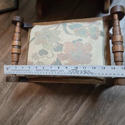 Wooden cane back glider with green cushions - a small table and an antique wooden stool