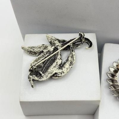 LOT 120: Collection of Silvertone Jewelry: Earrings & Brooches
