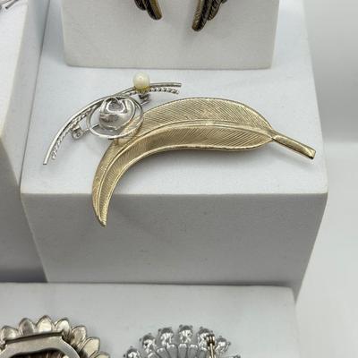 LOT 120: Collection of Silvertone Jewelry: Earrings & Brooches