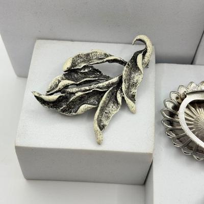 LOT 120: Collection of Silvertone Jewelry: Earrings & Brooches