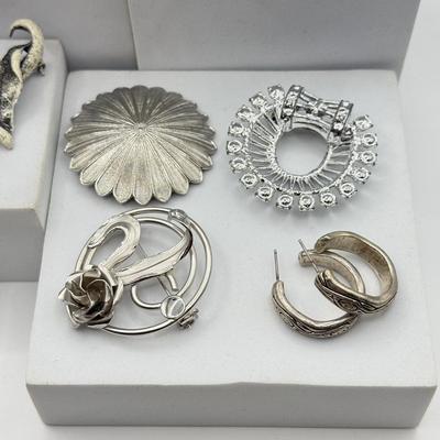 LOT 120: Collection of Silvertone Jewelry: Earrings & Brooches