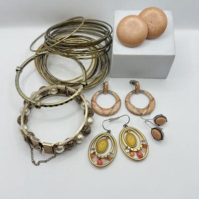LOT 181: Collection of Bangle Bracelets & Earrings