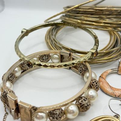 LOT 181: Collection of Bangle Bracelets & Earrings