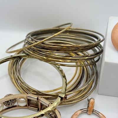 LOT 181: Collection of Bangle Bracelets & Earrings
