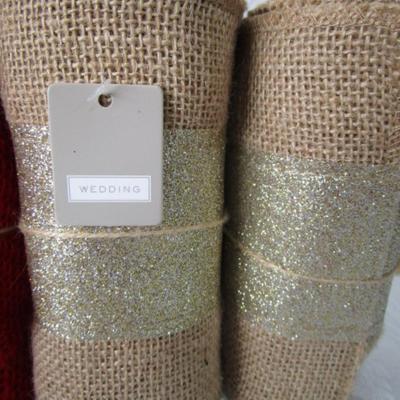 3 new rolls of burlap ribbon, 1 new pkg icicle ornaments