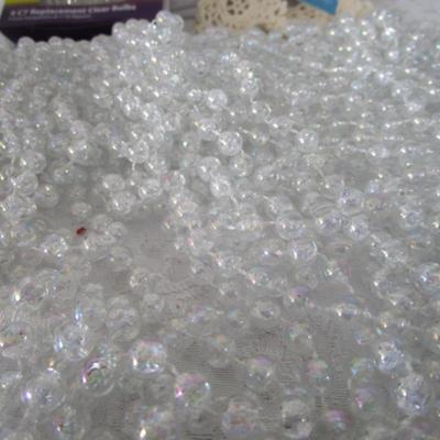 7 strings of beads, 2 crocheted snowflakes, pkg 3 bulbs, Tree skirt