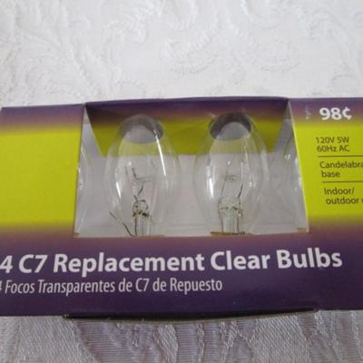 7 strings of beads, 2 crocheted snowflakes, pkg 3 bulbs, Tree skirt