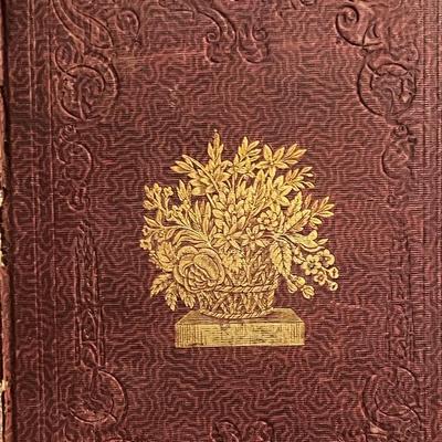 Sale Photo Thumbnail #47: Beautiful mid-19th century Victorian gift annual published by James M. Usher in 1848. Features an ornate embossed cloth binding with gilt floral basket design on the front cover and decorative Victorian border work. Includes the original binder’s emboss