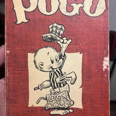 Sale Photo Thumbnail #56: Vintage 1951 POGO comic paperback by Walt Kelly. Early printing with classic artwork. Shows heavy cover wear and paper loss (see photos) but complete and readable. Great filler copy for collectors of early cartoon or comic strip books.