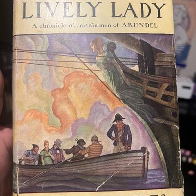 Sale Photo Thumbnail #60: Original 1931 First Edition of The Lively Lady by Kenneth Roberts, published by Doubleday, Doran. Includes original dust jacket featuring vibrant period artwork. Jacket shows edge wear, creasing, and small tears; book interior is clean with illustrated ma