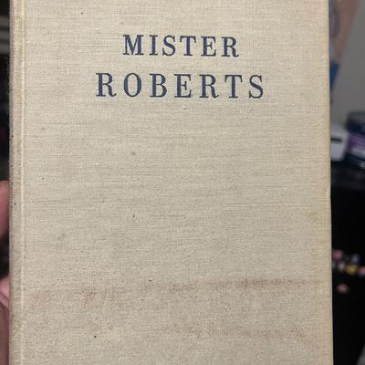 Sale Photo Thumbnail #64: Vintage hardcover copy of Mister Roberts by Thomas Heggen, published in 1946 by Houghton Mifflin. Later printing. Classic WWII naval novel that inspired the Broadway play and 1955 film. Beige cloth boards show visible staining and shelf wear; no dust jack